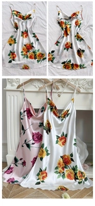 Detailed view of cowl neck and thin straps on a satin rose print dress with floral pattern
