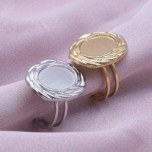 Macro shot of gold and silver oval geometric rings on soft pink velvet fabric