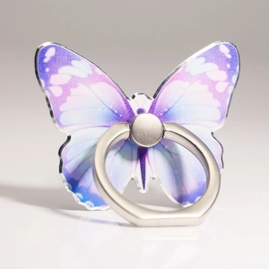 Macro view of purple gradient butterfly ring holder with acrylic wings and silver ring