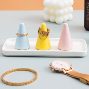 Creative ceramic jewelry display set with white rectangular tray and three colorful ring cones