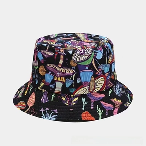 Close-up detail of the colorful mushroom print pattern on a black canvas bucket hat