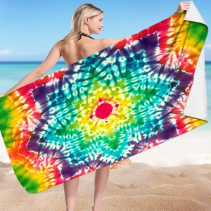 Detail of vibrant rainbow tie-dye mandala pattern on microfiber square beach towel