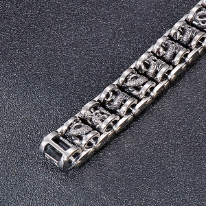 Close-up of vintage dragon pattern embossing on stainless steel bike chain bracelet