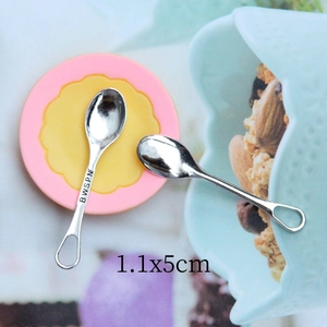 Macro shot of 1.1x5cm miniature silver metal spoons for dollhouse DIY accessories
