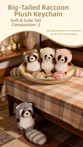 Close-up of fluffy long-tailed raccoon plush charms in warm home setting