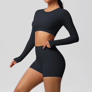 Side view of black long-sleeved crop top and high-waist shorts seamless yoga set