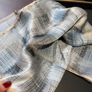 Silk neckerchief with blue and beige stripe texture pattern and hand-rolled edges
