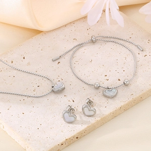 Silver heart jewelry set with shell inlay including necklace bracelet and earrings