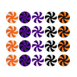 Set of spiral peppermint swirl ornaments in festive orange, purple, and black holiday colors