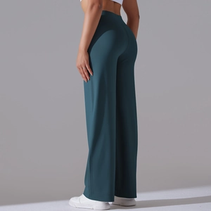 Macro shot showing high-waisted seamless design and soft teal fabric of yoga pants