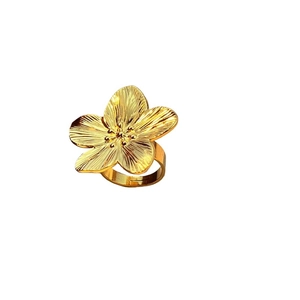 Three-dimensional golden petal ring in stainless steel against a clean white background