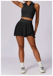 Detail of a black polo neck sports vest and pleated skirt set for tennis and gym