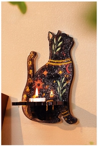 Detail of celestial cat wall-mounted candle holder featuring star and moon patterns
