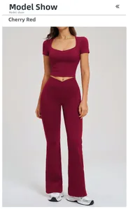 Two-piece yoga set with square neck crop top and flared leggings in cherry red color