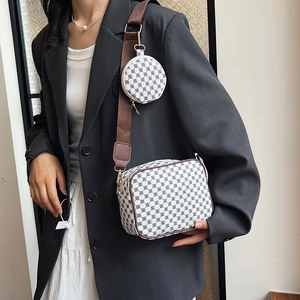Chic white crossbody camera bag with geometric floral print and round coin pouch