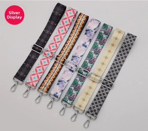 Detailed view of adjustable crossbody straps with silver hardware in seven colorful patterns