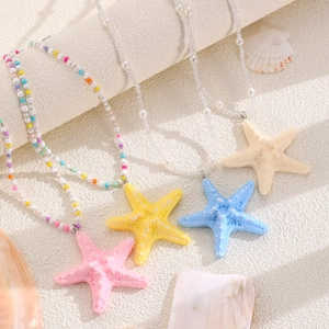 Set of four colorful starfish charm necklaces with vibrant beads for summer beach jewelry