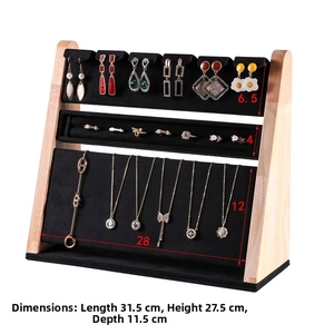 Detailed side view of 3-tier wooden jewelry display stand with black velvet layers