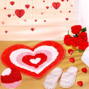 Valentine heart shaped floor mat detail, soft plush bathroom anti slip rug texture display.