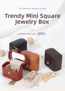 Internal view of mini PU jewelry box showing built-in mirror and ring storage slots