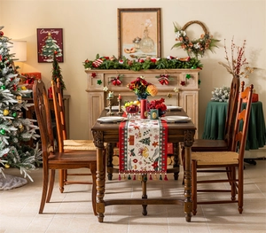 Detailed Christmas table runner with jacquard holiday patterns and festive tassels