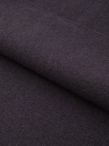 Detailed close-up of dark mauve knit fabric showing soft texture and fine weave