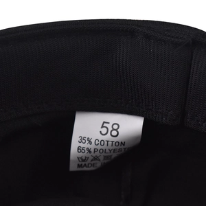 Detail of product care label showing 35% cotton 65% polyester blend and size 58