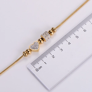 Minimalist gold heart charm bracelet with sparkling beads measured at 1.2cm charm width