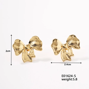 Detailed view of gold bow earrings with dimensions 2.4cm width and 2cm height