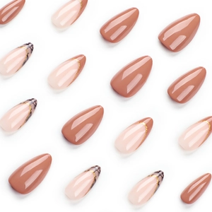 Brown and nude almond press-on nails with gold-edged plaid French tip design
