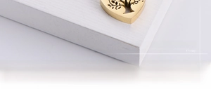 Detailed macro view of a gold-plated stainless steel hollow tree of life pendant