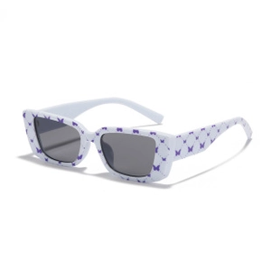 Macro shot of butterfly print on white frame sunglasses with dark grey lenses