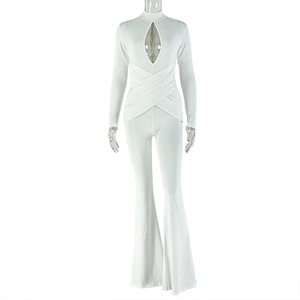 Detail of white long sleeve jumpsuit featuring neck cutout and flared leg design