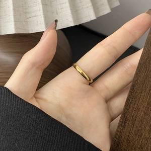 Close-up of minimalist 18K gold plated celestial ring featuring star and moon details
