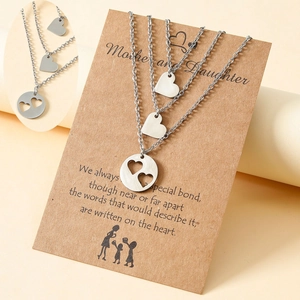 Three-piece stainless steel mother-daughter heart necklaces set on sentiment card