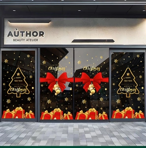 Close-up of golden Christmas tree and red ribbon bow electrostatic window stickers