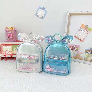 Cute children's sequin bow backpacks in silver and holographic blue colors