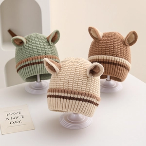 Detailed knit texture of children's striped beanies with cute 3D ears in various colors