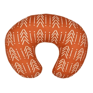 U-shaped nursing pillow with orange fabric featuring white abstract arrow patterns