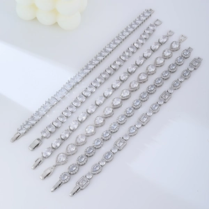 Detail of silver zirconia bracelets with various geometric crystal cuts in a row