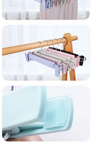 Detailed close-up of multi-color non-slip frosted plastic pants hangers with metal hooks