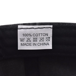 Detail of internal wash care label showing 100% cotton material and made in China text