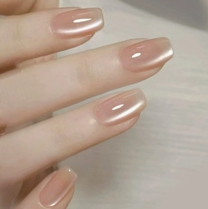 Pearlescent nude pink press-on nails in square oval shape with minimalist finish