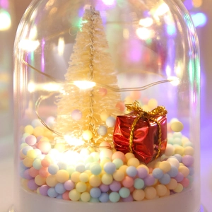 Christmas glass globe with cream-colored tree, LED warm lights, and colorful foam balls