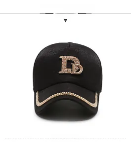 Detailed front view of black baseball cap with golden rhinestone D and jeweled brim edge