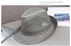 Close-up of grey breathable mesh weave on a summer jazz fedora hat for sun protection