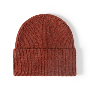 Classic rust red ribbed knit beanie with fold-over cuff for winter outdoor style