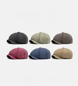 Close-up of vintage washed cotton newsboy caps in six diverse retro colors for selection