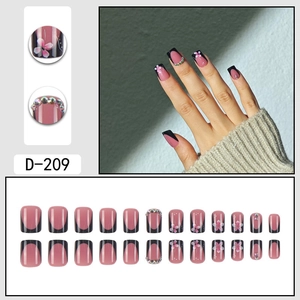 Pink French press-on nails D-209 with black edges, floral patterns and rhinestones