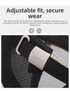 Detail of adjustable metal buckle and breathable mesh fabric on black baseball cap